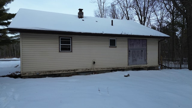 view of snow covered house