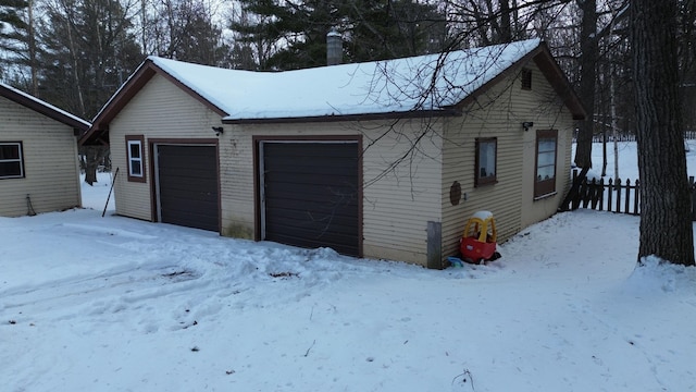 view of snow covered garage