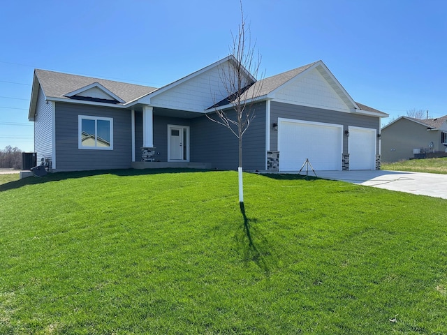 single story home featuring a front yard, a garage, and central air condition unit