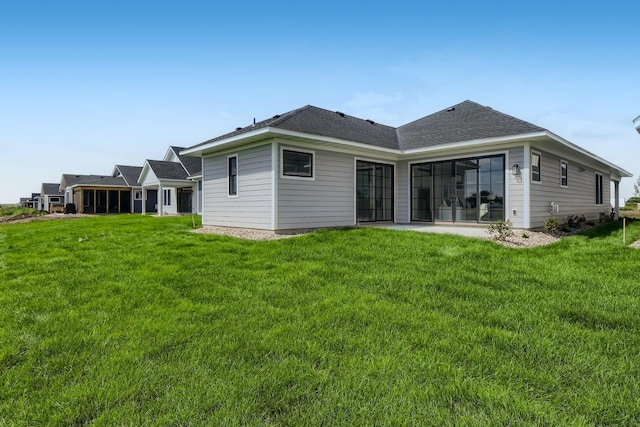 5243 217th St W, Farmington, MN 55024 - back of property featuring a yard and a shingled roof