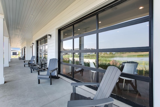 exterior space featuring wooden ceiling and a wealth of natural light