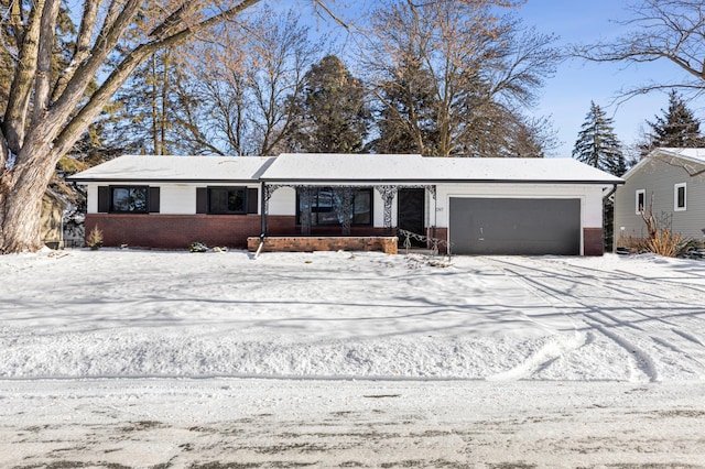 ranch-style house featuring a garage