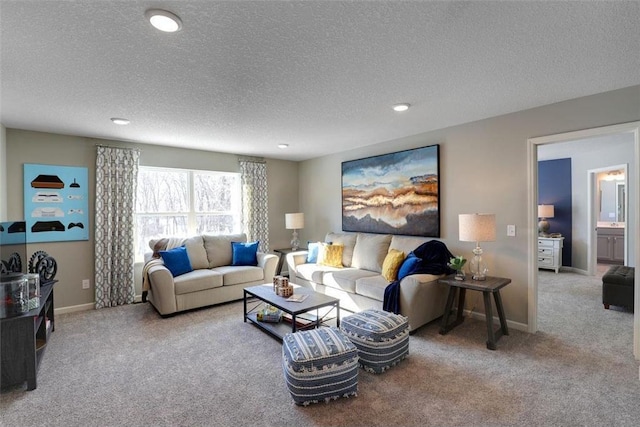 living room featuring carpet floors and a textured ceiling