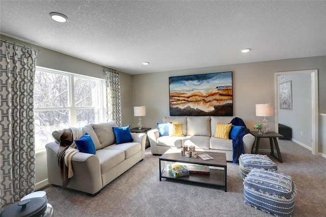 living room with carpet floors and a textured ceiling