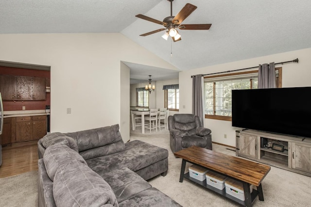 living room with light colored carpet and vaulted ceiling