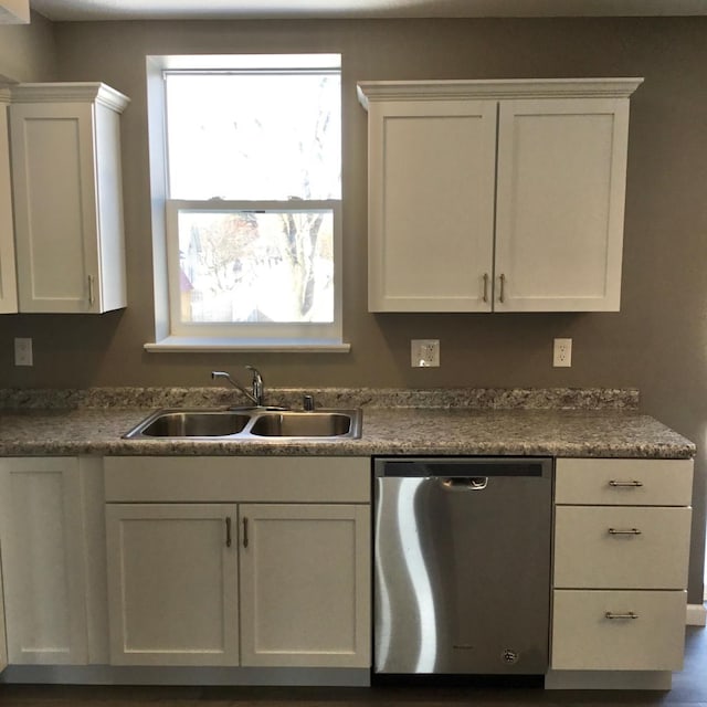 kitchen featuring white cabinetry, sink, and stainless steel dishwasher