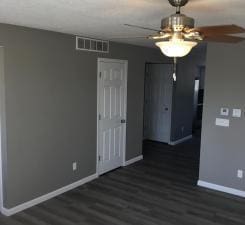 unfurnished room with dark wood-type flooring