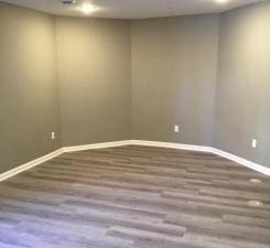 unfurnished room featuring hardwood / wood-style flooring