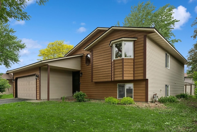 4118 136 1/2 St, Savage, MN 55378 - view of front of house featuring driveway, a garage, and a front lawn