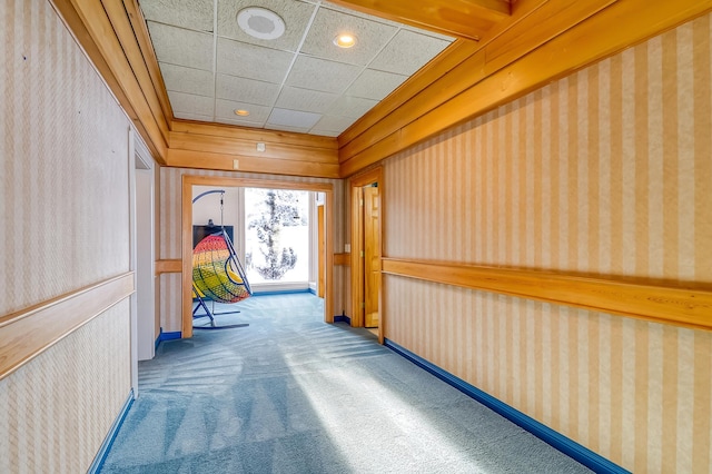 hallway with carpet floors