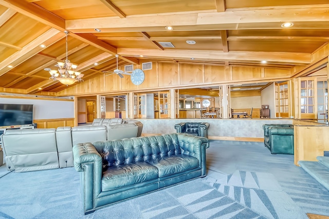 interior space featuring carpet floors, wood walls, vaulted ceiling with beams, an inviting chandelier, and wooden ceiling