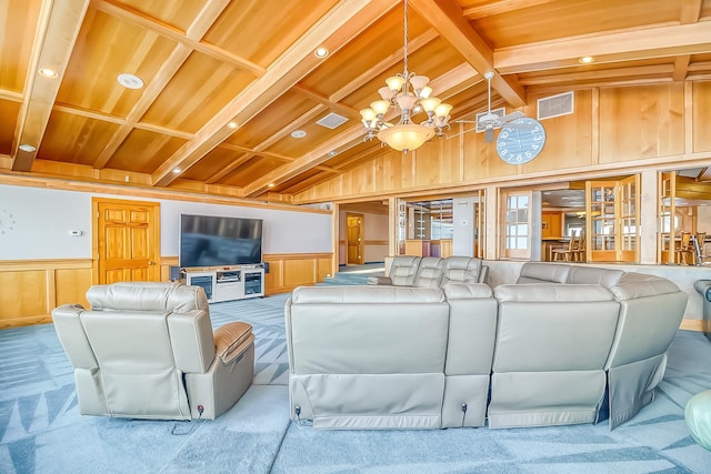 carpeted living room featuring wooden ceiling, a chandelier, and vaulted ceiling with beams