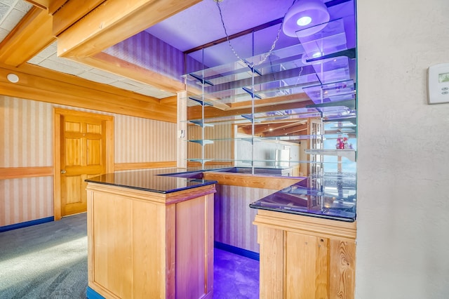 bar with carpet and light brown cabinets