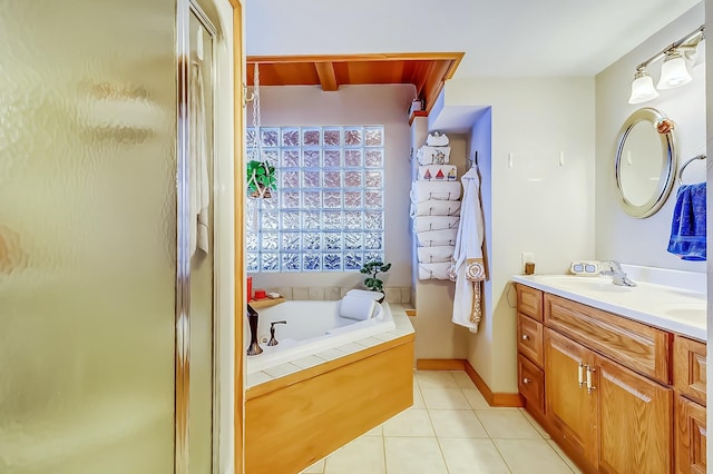 bathroom with vanity, tile patterned floors, and plus walk in shower