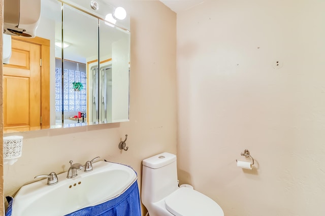 bathroom with toilet and sink