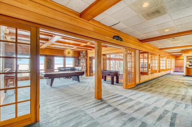 playroom featuring billiards, beamed ceiling, wooden walls, and carpet flooring