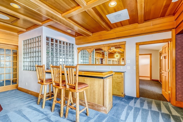 bar featuring beam ceiling, wood ceiling, coffered ceiling, and dark colored carpet