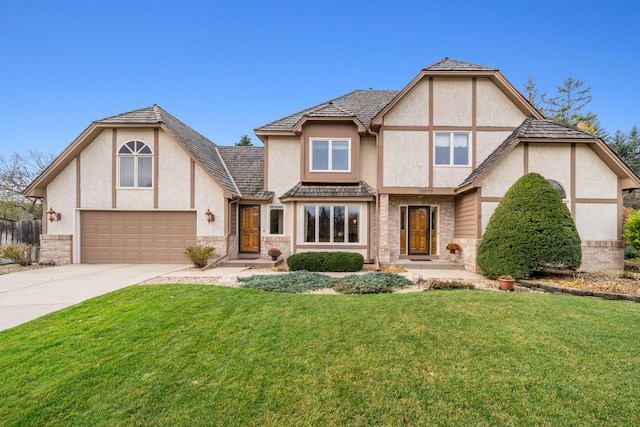 english style home featuring a front lawn