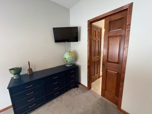 bedroom featuring light carpet