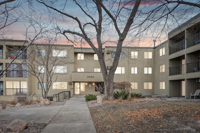 view of outdoor building at dusk