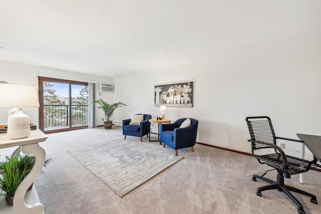 carpeted office featuring a wall unit AC