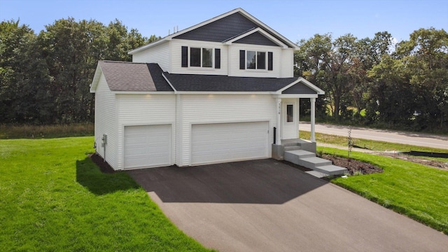 view of front of property with a front yard and a garage