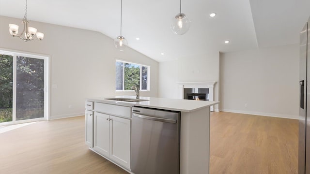 kitchen with sink, an island with sink, stainless steel dishwasher, and light hardwood / wood-style floors