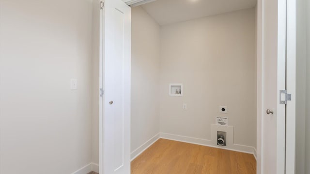 laundry room featuring washer hookup, light hardwood / wood-style floors, and hookup for an electric dryer