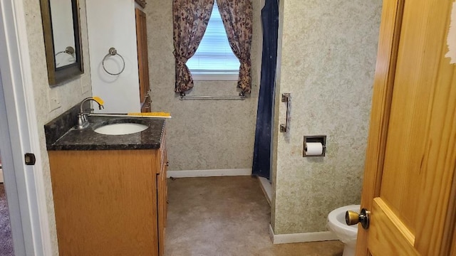 bathroom with vanity and toilet