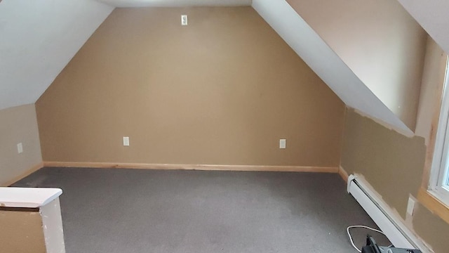 additional living space with carpet flooring, a baseboard radiator, and vaulted ceiling