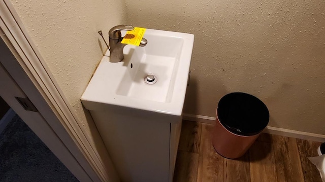 bathroom featuring sink and wood-type flooring