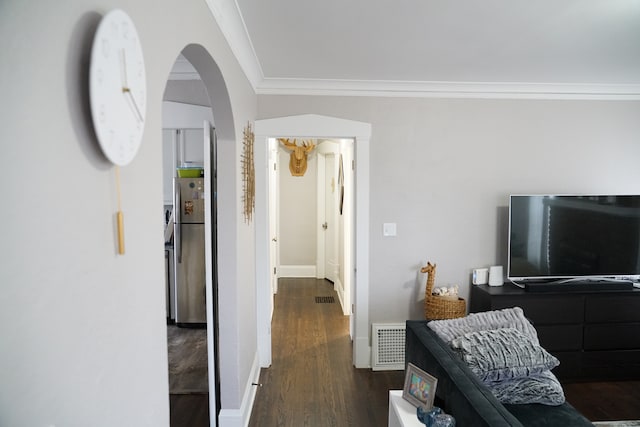 living room with dark hardwood / wood-style floors and crown molding