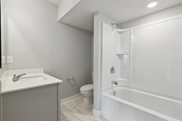 full bathroom featuring vanity, tile patterned floors, shower / washtub combination, toilet, and a textured ceiling