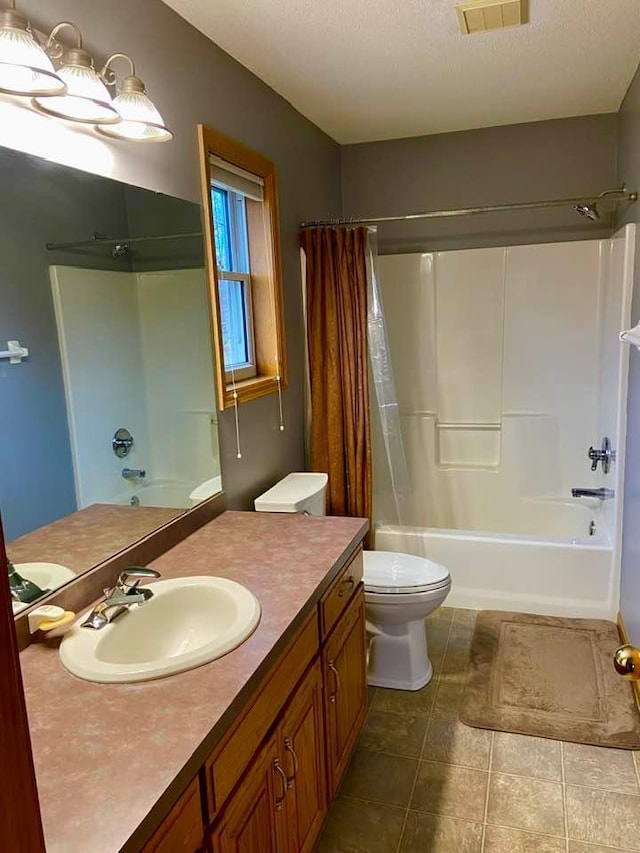 full bathroom with toilet, a textured ceiling, shower / bathtub combination with curtain, and vanity