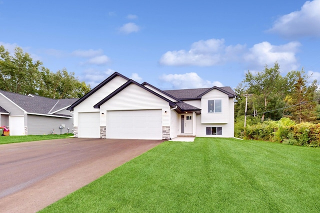 view of front facade with a front yard and a garage