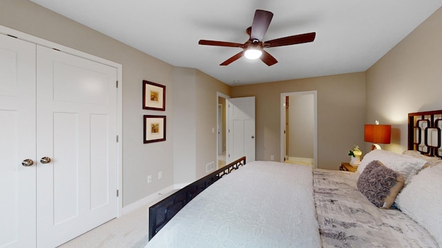 bedroom with ceiling fan, a closet, and carpet