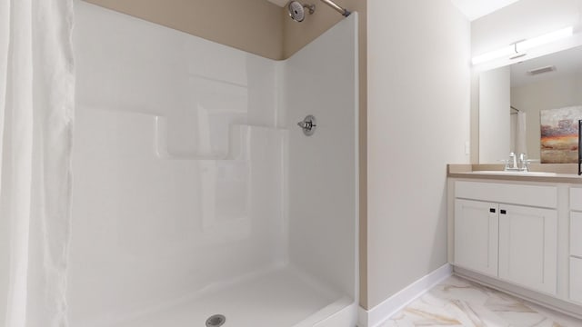 bathroom with vanity and walk in shower