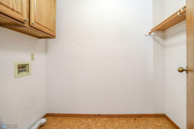 washroom featuring cabinets and washer hookup