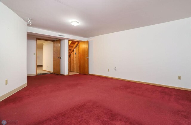 empty room featuring carpet flooring