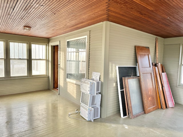 unfurnished sunroom featuring wooden ceiling