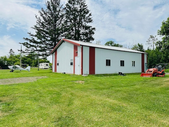 view of outdoor structure with a lawn