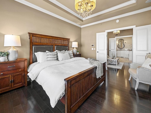 bedroom featuring a tray ceiling, dark hardwood / wood-style floors, ornamental molding, and a chandelier