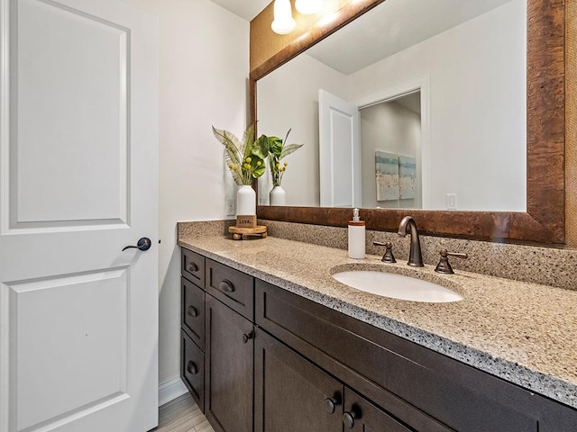 bathroom featuring vanity and hardwood / wood-style floors