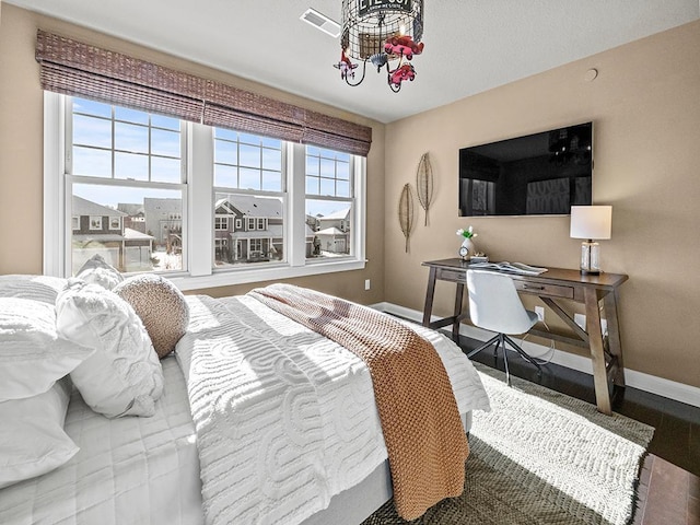 bedroom featuring an inviting chandelier