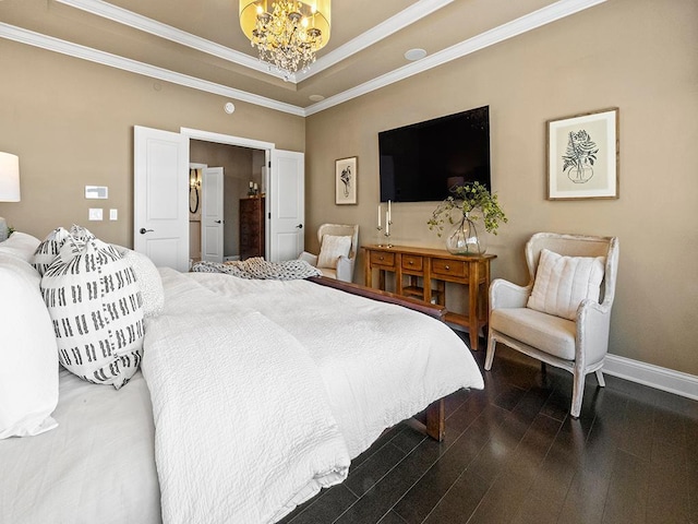 bedroom featuring a tray ceiling, a notable chandelier, crown molding, and dark hardwood / wood-style floors