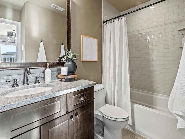 full bathroom with toilet, shower / bath combo, and vanity