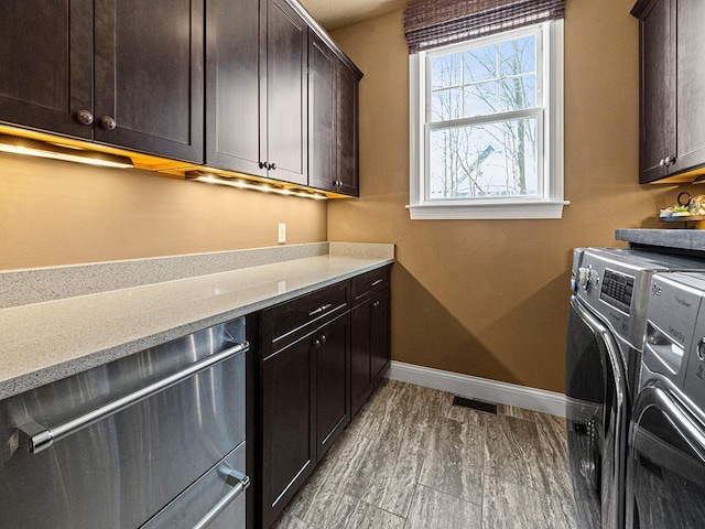 laundry area featuring cabinets and washer and dryer