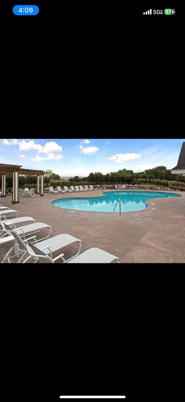 view of swimming pool featuring a patio area