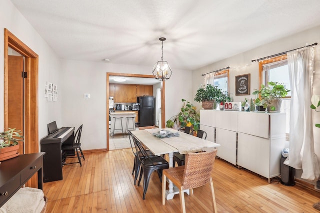 dining room featuring a chandelier and light hardwood / wood-style floors