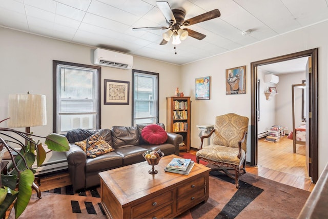 living room with hardwood / wood-style flooring, ceiling fan, a wall mounted air conditioner, and baseboard heating